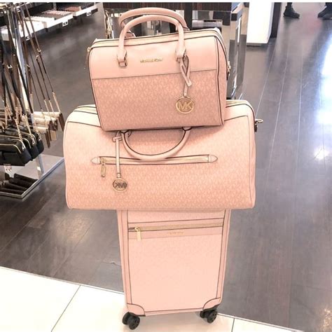 michael kors pink suitcase.